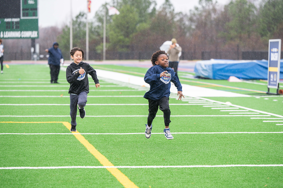 Local kids and caregivers from military and veteran families participate in the 40-yard dash drill at “USAA’s Heroes Huddle at the Army-Navy Game” with Robert Griffin III (RGIII). USAA, presenting sponsor of the Army-Navy Game, RGIII and the Elizabeth Dole Foundation are giving back to these local heroes in honor of the 125th playing of ‘America’s Game' with the event on December 11, 2024, in Landover, MD. (Photo by Joy Asico-Smith/AP Images for USAA)