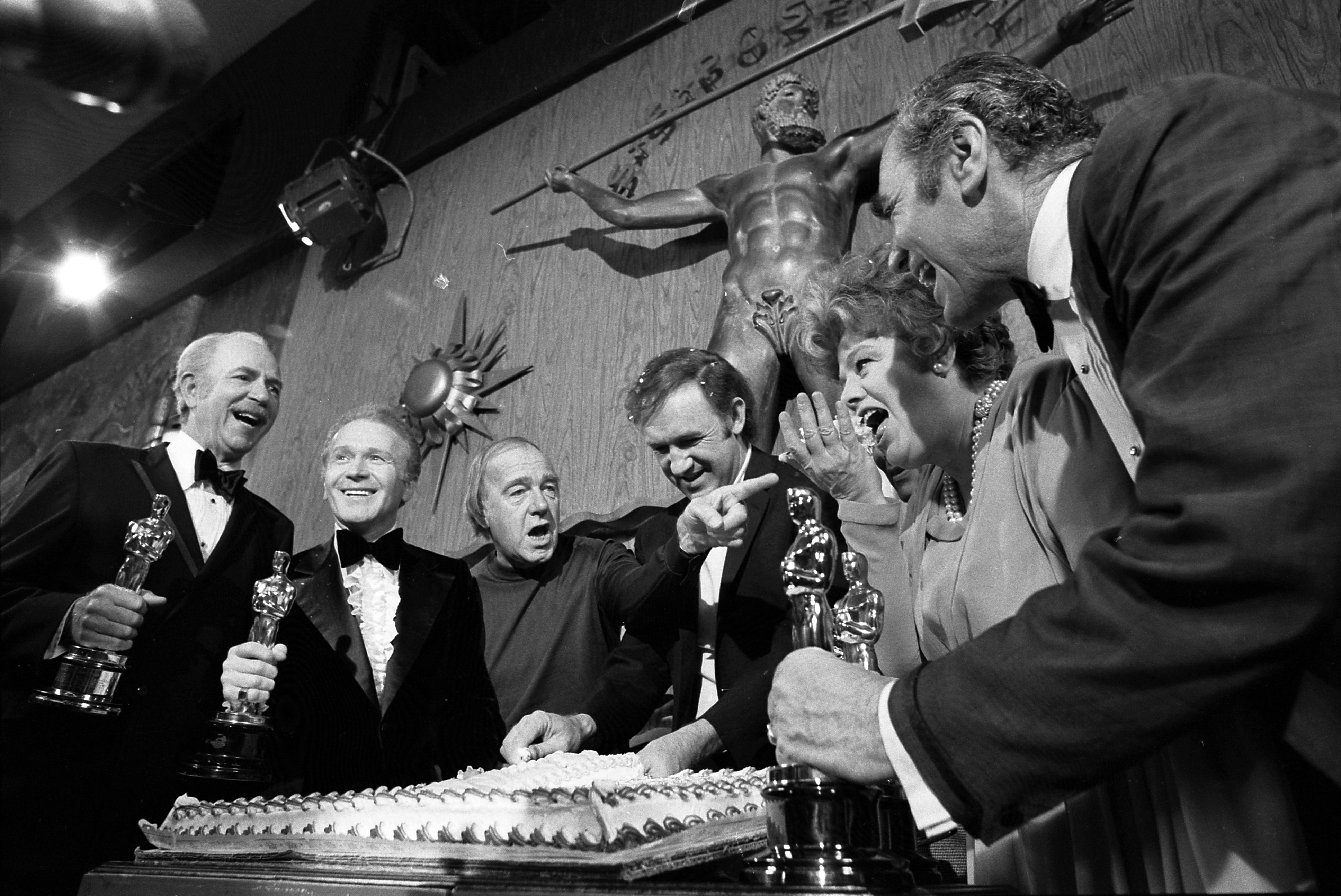 Gene Hackman cuts cake at Academy Awards
