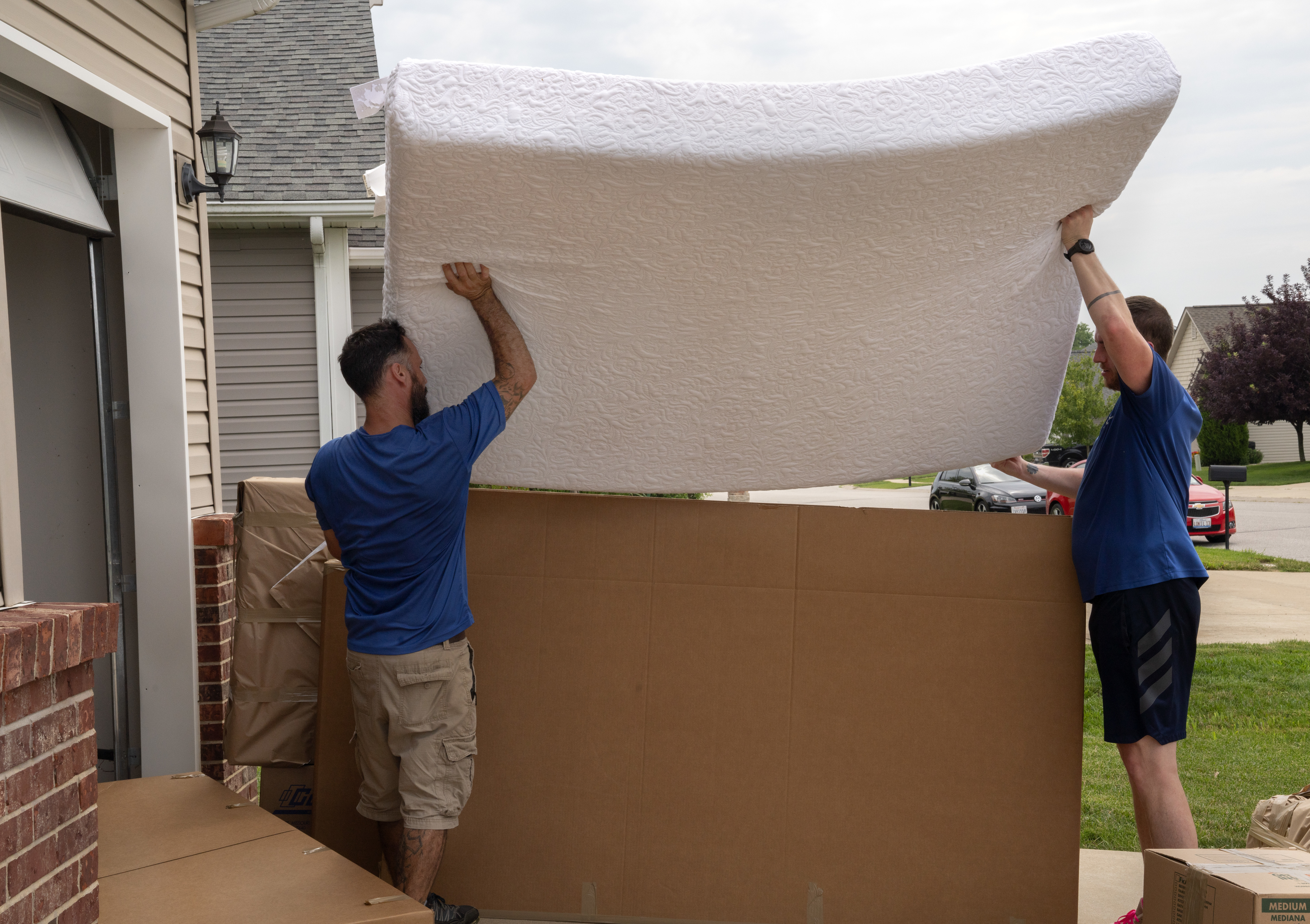 Movers pack a military members property into boxes and load it into crates to be tranferred to a temporary storage facility in O'Fallon, Illinois, July 1, 2019. (Photo by Stephenie Wade)