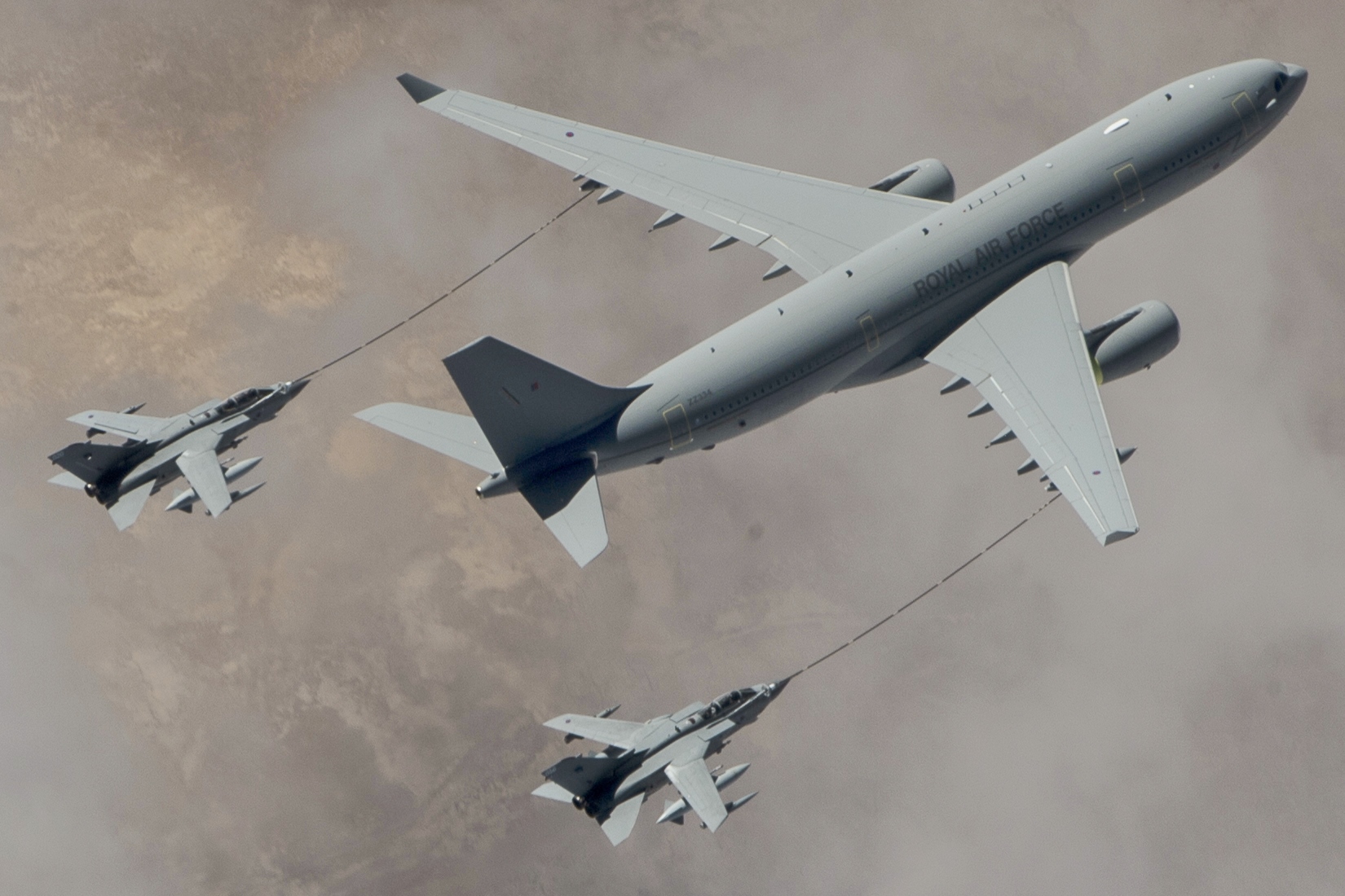 A Royal Air Force Voyager KC2 refuels two RAF Tornado GR4, March 4, 2015, over Iraq. The RAF aircraft provide combat air support for the coalition against Da'esh. (U.S. Air Force photo by Staff Sgt. Perry Aston/RELEASED)