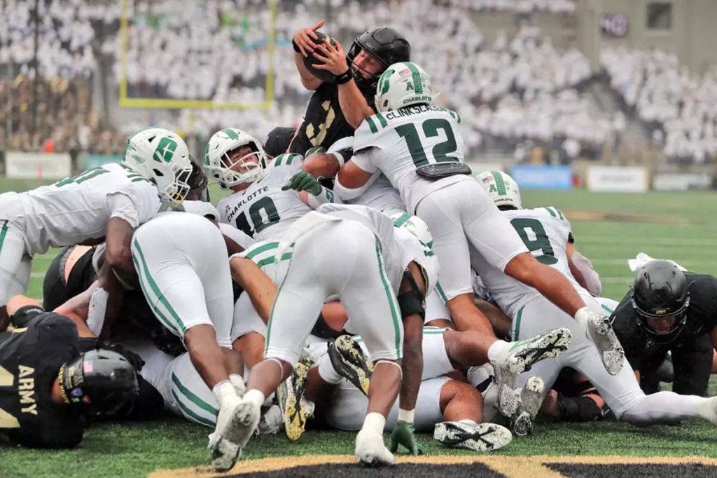 Army Black Knights quarterback Cale Hellums reaches over the ice for a touchdown against the Charlotte 49ers during the second half at Michie Stadium.