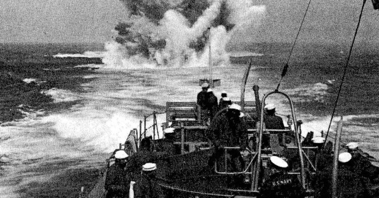 A depth charge explodes astern, as the crew of the USS PC-1264 practices a simulated submarine attack during the ship's shakedown cruise off southern Florida.