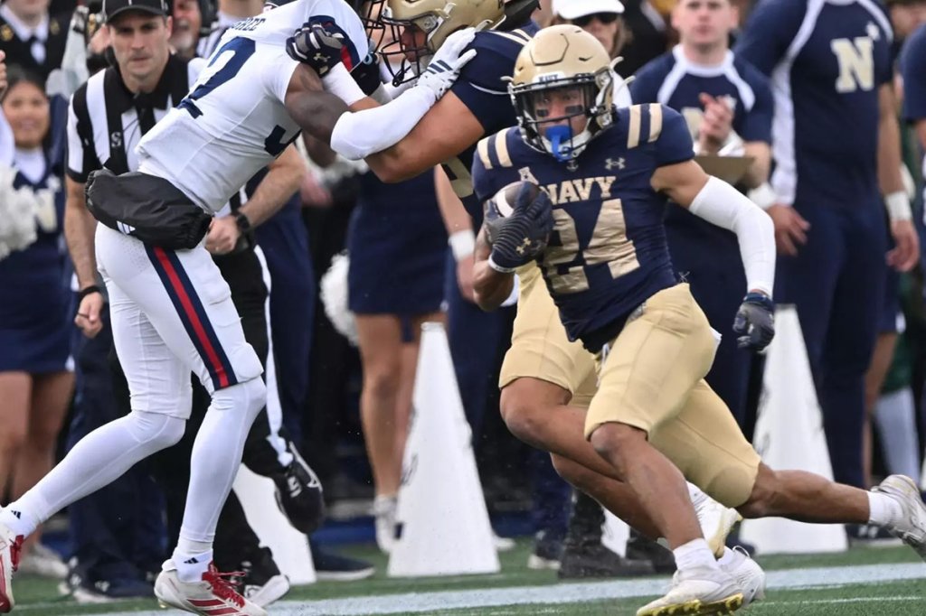Navy runner byron white rushes against the FAU owls
