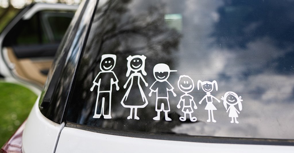 Happy family on board. Sticker on the back of car. Four kids.