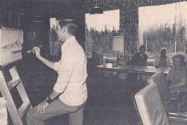 A photo of Bob Ross painting while he was still in the Air Force.