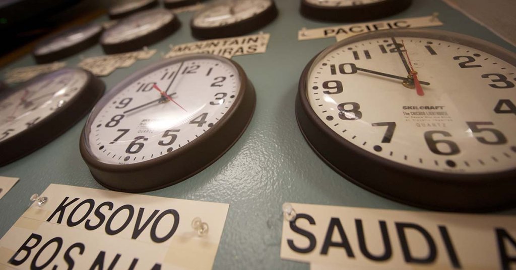Operations center with multiple clocks including UTC for synchronization.