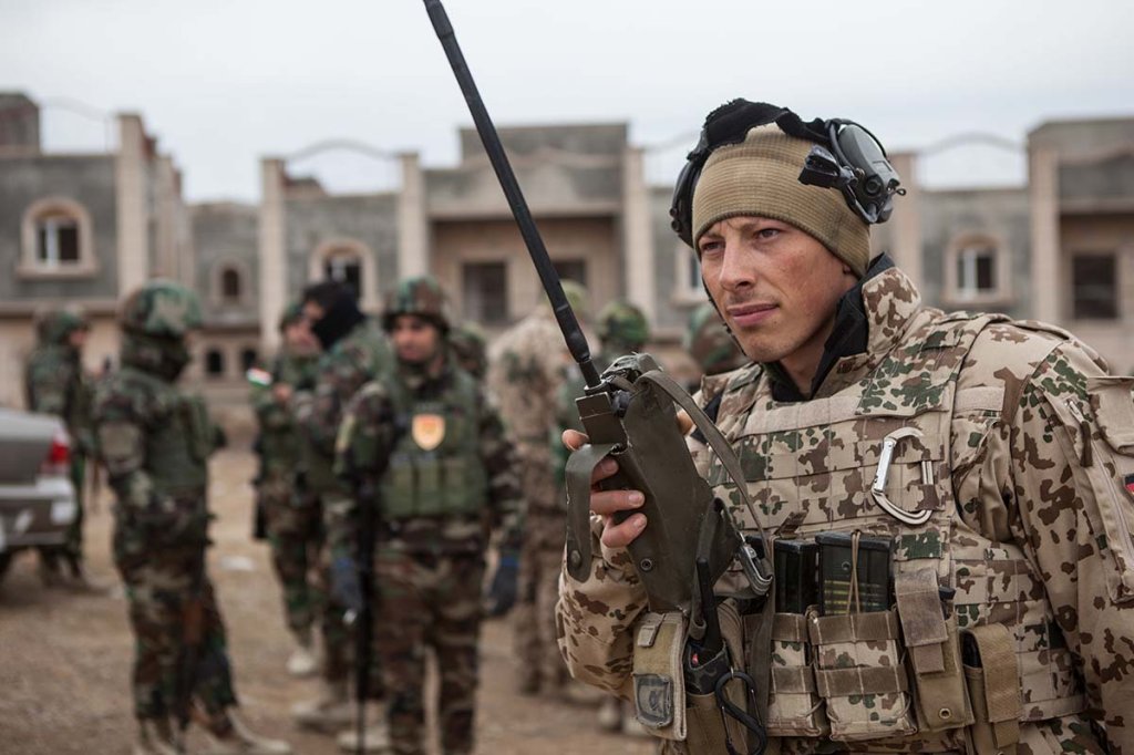 German service member conducts a radio check using military time.