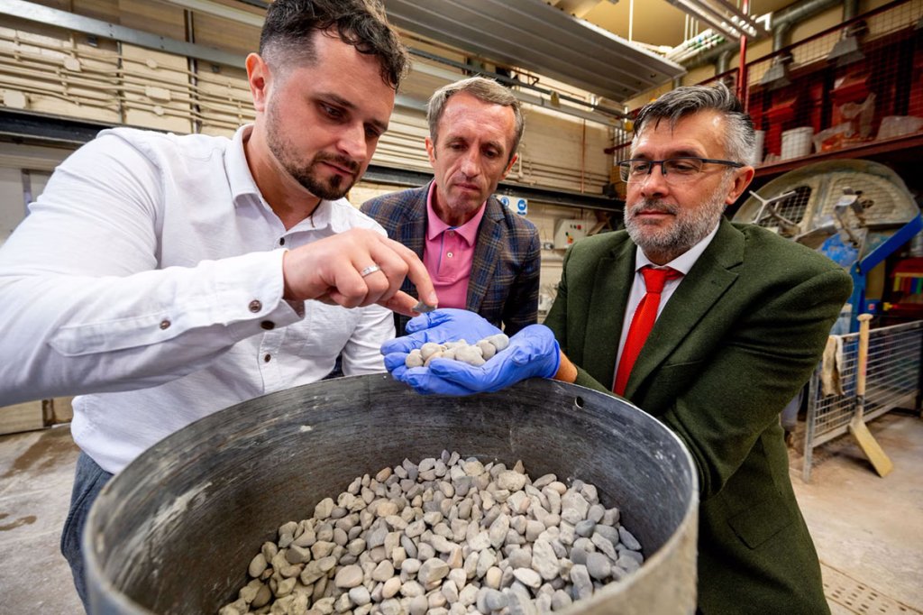 Ukrainian academics Oleksii Hunyak (left) and Taras Markiv (center), and British academic Leon Black, inspect fragments of recycled concrete in Leeds.