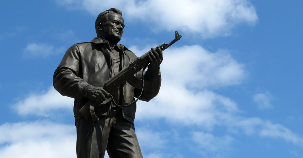 myths and facts ak-47 Monument to the weapons developer Mikhail Kalashnikov on blue sky background. The creator of the Kalashnikov assault rifle AK-47, soviet and russian designer of small arms