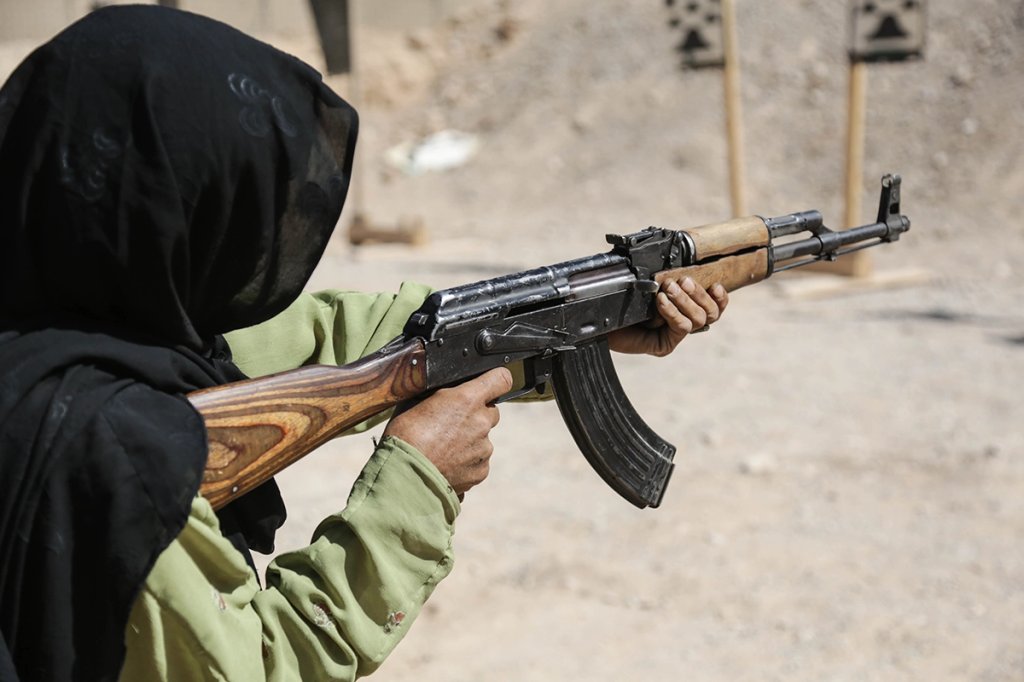 A female Afghan Uniformed Police member fires an AK-47 rifle at a target during training in Zharay district, Kandahar province, Afghanistan, Sept. 20, 2013. A U.S. Cultural Support Team along with special operations forces team members conducted the training in order to provide the women with the necessary training to carry out their duties. (U.S. Army/Staff Sgt. Kaily Brown) myths and facts ak-47