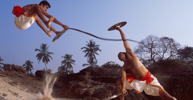 The Healing Warriors Of India CALICUT, KERALA, INDIA - JANUARY 01: If the existence of the flexible sword is mentioned in Nothern Ballads (popular songs of Kerala, composed on the XVIth centuary), its description is vague and they are no evidences that the weapon practised in today gymnasium looks like the original. Further more, no oral command has been found. Master Shathrughnan (on the right) asserts that the practise of this weapon is dangerous. Injuries to the head often occurs. Gymnasium is Hindustan Kalari of Calicut Kerala on January 01, 2010 in Calicut Kerala, India. (Photo by Herve BRUHAT/Gamma-Rapho via Getty Images)
