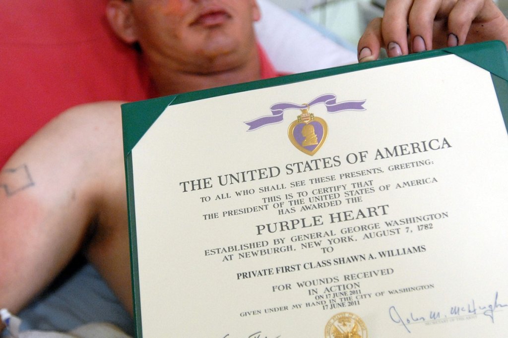 golden hour campbell purple heart army U.S. Army Pfc. Shawn Williams of the 1st Stryker Brigade Combat Team, 25th Infantry Division, based in Fort Wainwright, Alaska, displays his Purple Heart certificate after being awarded the medal for wounds received in action