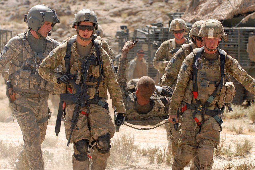 U.S. Army Pfc. Shawn Williams of the 1st Stryker Brigade Combat Team, 25th Infantry Division, based in Fort Wainwright, Alaska, gives the thumbs-up to members of his unit as he is evacuated after being injured by a roadside bomb, Friday, June 17, 2011, in the Kandahar province of Afghanistan.