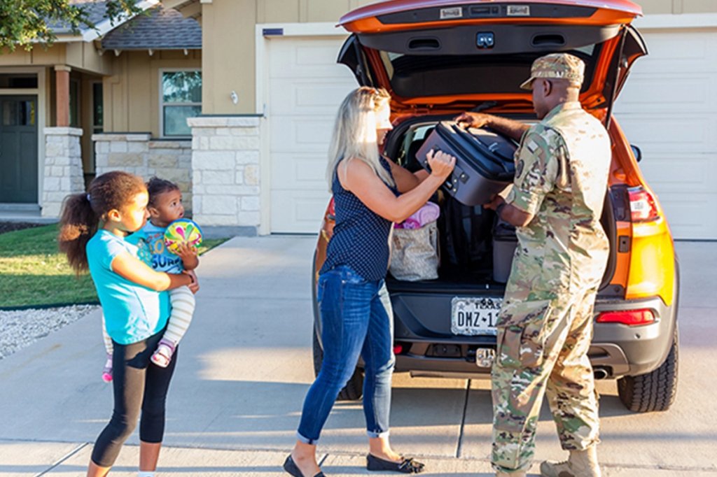 A mover loads boxes into the truck for transport to the next duty station during a Permanent Change of Station on Scott Air Force Base, Illinois, July 18, 2025. The Department of Defense established the Permanent Change of Station Joint Task Force to improve the moving experience for military members and their families. (U.S. Air Force photo by Staff Sgt. Stephanie Henry)