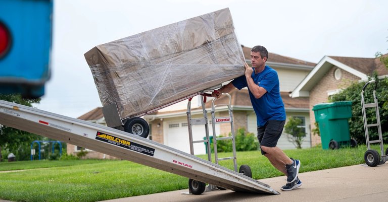hidden pcs costs moving truck army loading boxes into the truck for transport to the next duty station during a Permanent Change of Station on Scott Air Force Base, Illinois, July 18, 2025. The Department of Defense established the Permanent Change of Station Joint Task Force to improve the moving experience for military members and their families. (U.S. Air Force photo by Staff Sgt. Stephanie Henry)