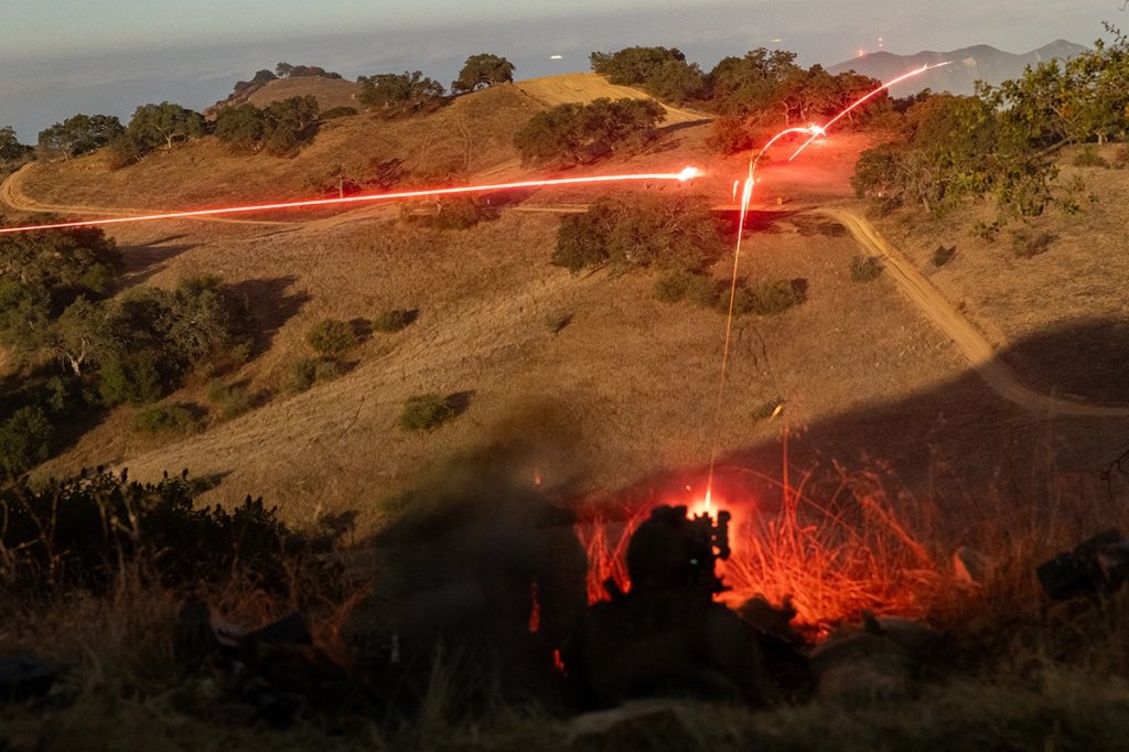 A U.S. Marine with Charlie Company, 1st Reconnaissance Battalion, 1st Marine Division, fires an M240B medium machine gun during a combat readiness evaluation at Marine Corps Base Camp Pendleton, California, Oct. 8, 2025. The combat readiness evaluation is a formal test based on mission essential tasks that evaluates the combat readiness of Marine units. (U.S. Marine Corps photo by Sgt. Kyle Chan)
