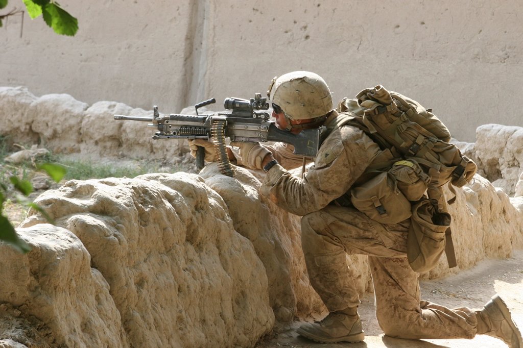 Lance Cpl. John F. Farias, an M-249 Squad Automatic Weapon machine gunner provides security during a patrol designed to link up with Marines of a different squad in the Upper Sangin Valley, June 26. “Third Platoon really is the tip of the spear as the northern most unit in the 1/5 battle space. We are in firefights every day. The minute we pass the first tree line there is a 90 percent chance we are going to get contact, which is good because we are here to draw them into contact,” said Farias. “We are acting as a shield for the guys down south and keep pushing the insurgents north.” Farias was killed in action in the area when his squad came under fire June 28. Farias, 20, was from New Braunfels, Texas, and graduated from Canyon High School in 2009.