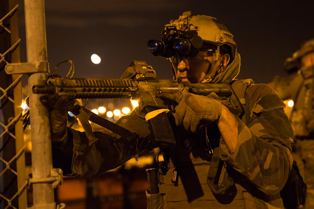 Marine Raiders with 1st Marine Raider Battalion provide security while conducting a simulated night-raid on a warehouse in Los Angeles. (U.S. Marine Corps/Sgt. Scott A. Achtemeier)