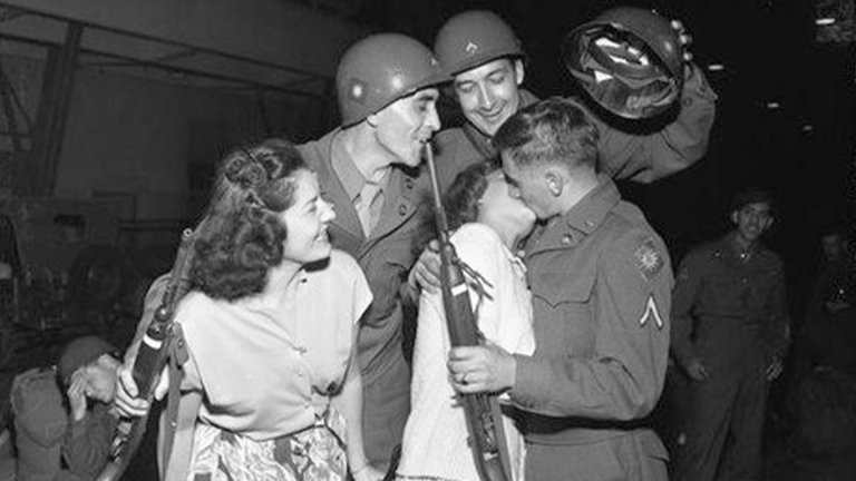 California National Guardsmen kissing their wives goodbye as they depart for Camp Cooke. (U.S. Army)