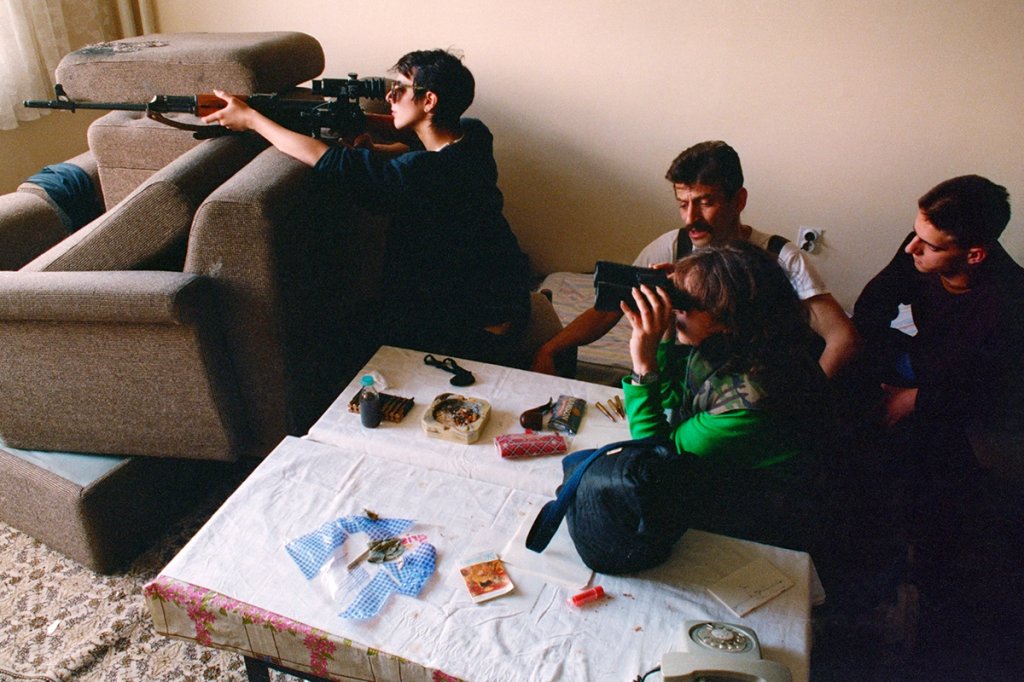 Bosnian snipers, including Nadia Jeriagic, at left, shoot at Serbian snipers in the mountains from their position on the 20th floor of a Sarajevo building. (Photo by David Turnley/Corbis/VCG via Getty Images)