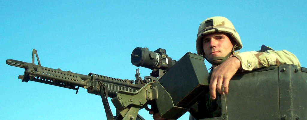 Air Force Senior Airman Bryant, ensconced in a turreted vehicle Dec. 20 at a U.S. military facility in the Middle East, scans the horizon with a night-scope-equipped M-60 machine gun at the ready. (Photo by Gerry J. Gilmore)