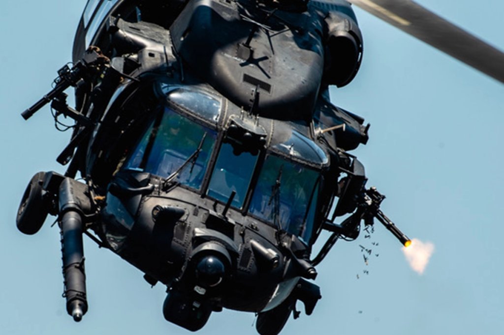 U.S. Special Operations Forces members fly over Tampa Bay, Florida in a U.S. Army MH-60 helicopter during a SOF capabilities demonstration May 18, 2022. SOF Week is the premier gathering for theSOF community and industry, bringing together more than 11,000 attendees, including representatives from more than 100 countries to collaborate on new initiatives and capabilities needed for SOF professionals to compete and win in the future. (U.S. Air Force photo by Staff Sgt. Alexander Cook)