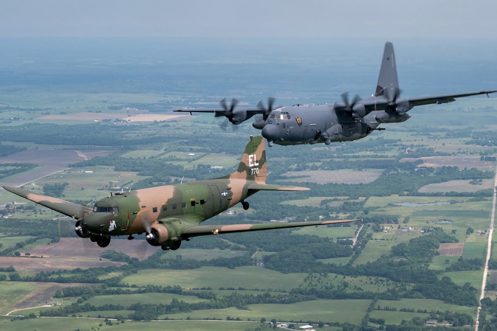 An AC-47 from Topeka, Kansas, and an AC-130J Ghostrider from the 4th Special Operations Squadron at Hurlburt Field, Fla., fly in formation around Topeka June 25 in preparation for a gunship legacy flight that will be flown at EAA AirVenture July 30 and 31. Air Force Special Operations Command Airmen and aircraft will be among the highlighted programs at EAA AirVenture Oshkosh 2021. The AC-47 belongs to the American Flight Museum in Topeka and is restored as John Levitow’s Medal of Honor aircraft. The AC-130J Ghostrider's primary missions are close air support, air interdiction, and armed reconnaissance. (U.S. Air Force photo by MSgt Christopher Boitz)