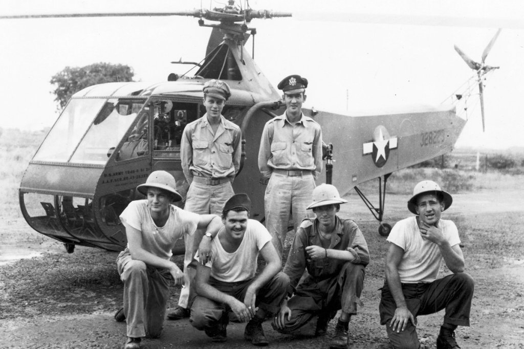 Lieutenant Carter Harman, 1st Air Commando Group, (standing, left) with Sikorsky YR-4B 43-28223, Burma, 26 April 1944. The other officer standing next to Harman is Lieutenant Frank Peterson. Harman’s crew chief, Sergeant Jim Phelan, is kneeling at right. (U.S. Air Force)
