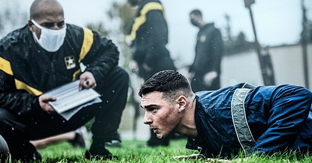 U.S. Air Force Airman 1st Class Brandon Peacock performs Hand Release Push-Up Arm Extensions while being observed by U.S. Army Sgt. 1st Class Danny Gonzalez, a Master Fitness Trainer get in shape 2026 fitness test