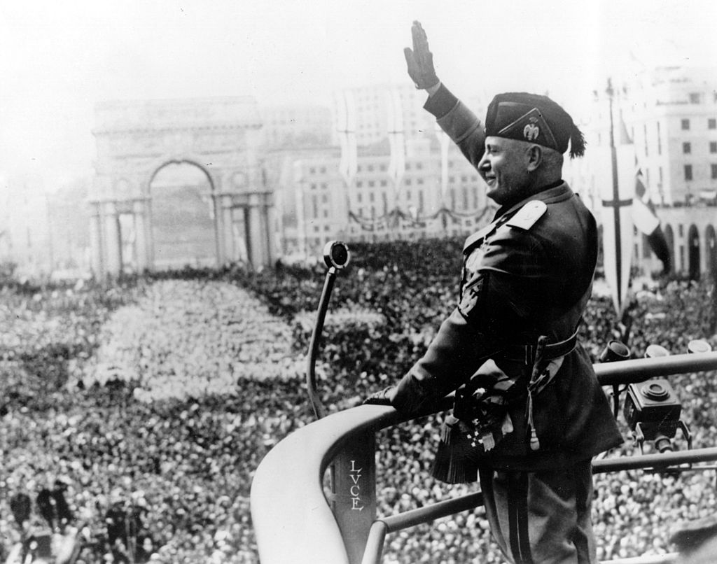 Italian dictactor Benito Mussolini (1883 - 1945) saluting during a public address. (Photo by Keystone/Getty Images)