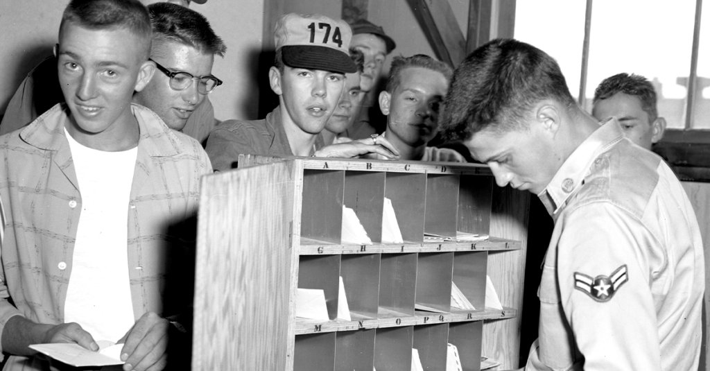 Airmen from the Iowa Air National Guard’s 174th Fighter Squadron wearing a first generation 174th FS organizational ball cap waits to receive mail during a mail call