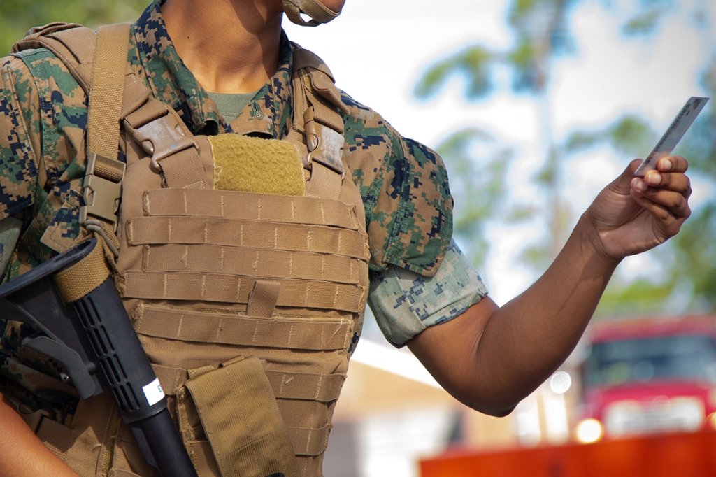 military id election common access card dvids U.S. Marine Corps Pfc. Ruth Polancorivera, Santo Domingo, Dominican Republic native, legal services specialist, Headquarters and Support (H&S) Battalion, Marine Corps Installations East (MCIEAST) – Marine Corps Base (MCB) Camp Lejeune, checks common access cards during Exercise Urgent Response on MCB Camp Lejeune.