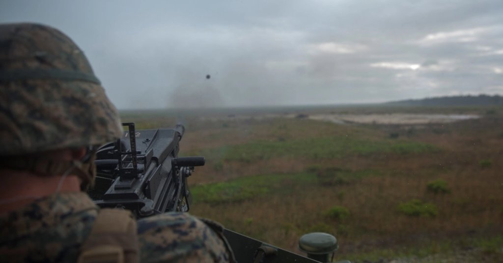 A Marine from 2nd Marine Division fires a MK-19 grenade launcher during the Advanced Machine Gunners Course at range G-3 aboard Camp Lejeune, N.C., April 30, 2015. In order to learn a new engagement method previously only employed by mortarmen, the Marines shot the MK-19 grenade launcher from behind a berm at targets that were not visible to them so that they could fire at the enemy without being in harm’s way. (U.S. Marine Corps Photo by Lance Cpl. Aaron Fiala/Released)