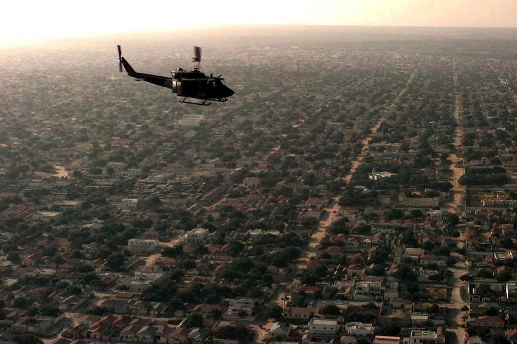 A Marine Corps UH-1N "Huey" helicopter flies over a Mogadishu residential area on a patrol mission to look for signs of hostilities in support of Operation Restore Hope. (Department of Defense)