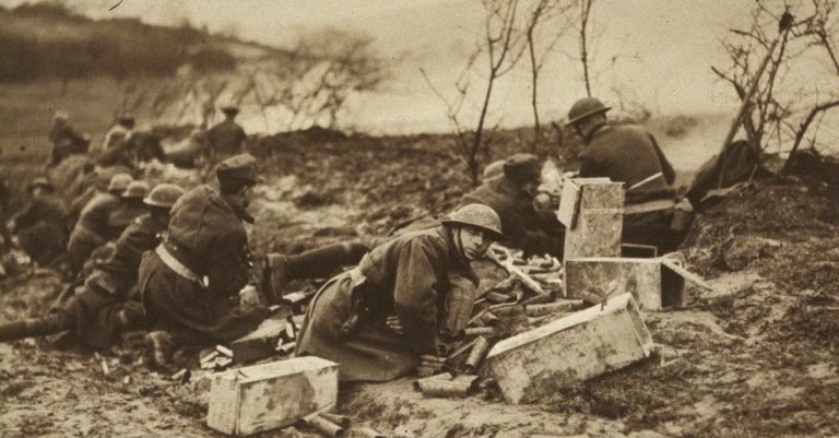 National Guard Soldiers of the 165th Infantry (formerly the 69th Regiment, New York National Guard) prepare to move forward with weapons at the ready during an attack at Landres-et-St. Georges in October 1918. The 165th Infantry fought as part of the 42nd “Rainbow” Division during St. Mihiel in September and Meuse-Argonne in October, part of the American Expeditionary Force 100 days offensive that brought an end to World War I.