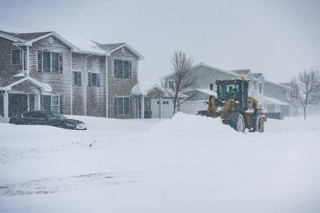 frozen family snow plow minot usaf