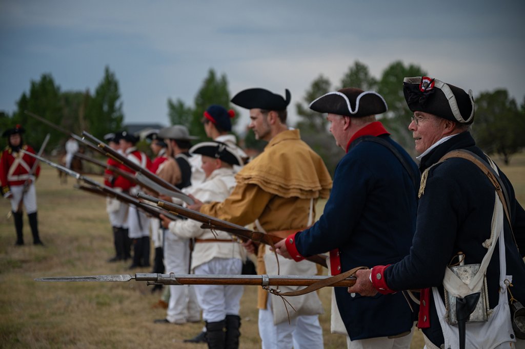 American Revolution era historical reenactors perform a firing and marching presentation at Fort D.A. Russell Days at F.E. Warren Air Force Base, Wyoming, July 19, 2024. Fort D.A. Russell Days is an annual event that celebrates F.E. Warren AFB’s history from the 1800s to present. (U.S. Air Force photo by Senior Airman Sarah Post)