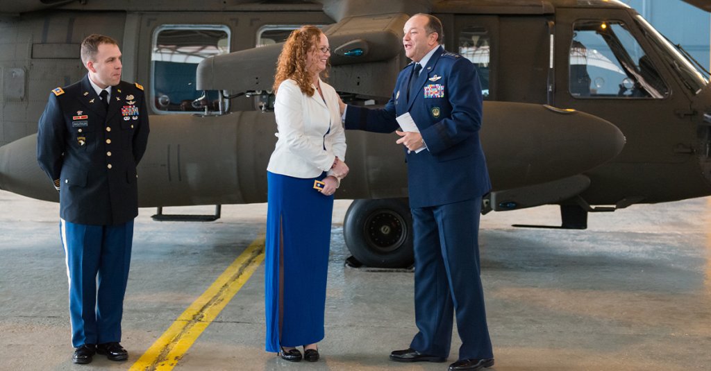 U.S. Air Force Gen. Philip M. Breedlove, Supreme Allied Commander Europe, thanks Melissa Wojtkun for her dedication a service member spouse