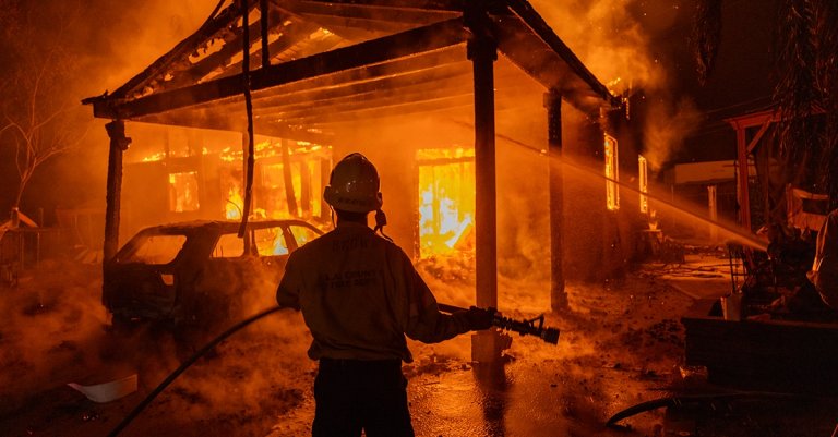 Firefighters battle the Eaton Fire on January 8, 2025 in Altadena, California. Powerful Santa Ana winds pushed the fire across more than 10,000 acres in less than 24 hours.