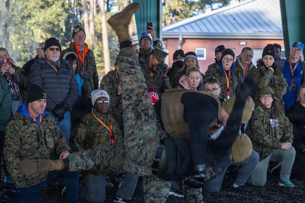 Educators from Recruiting Stations Orlando, Tampa, and Fort Lauderdale receive a demonstration of different Marine Corps Martial Arts techniques.