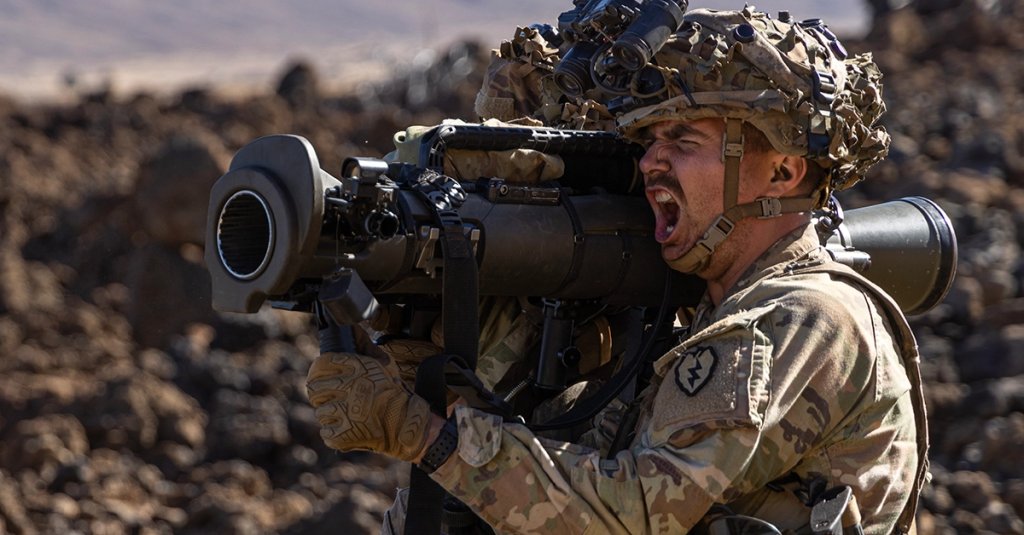 A soldier with the 25th Infantry Division, yells as he dry fires a Carl Gustaf 8.4 cm recoilless rifle at Pohakuloa Training Area, Hawaii.