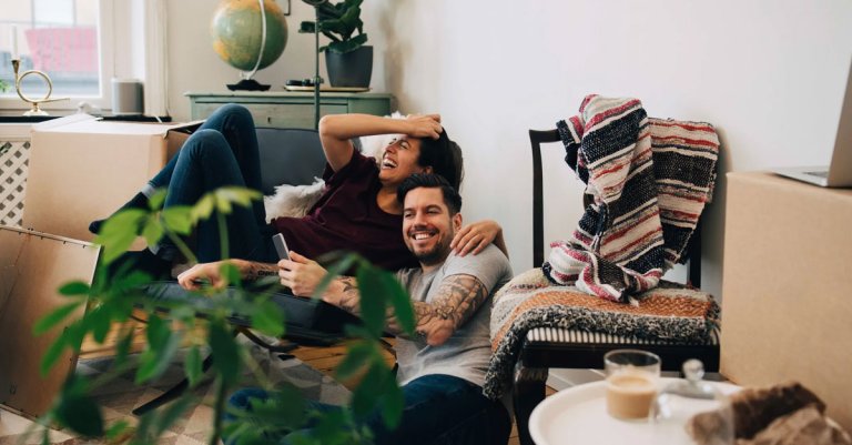 first time homebuyer couple moving in and celebrating