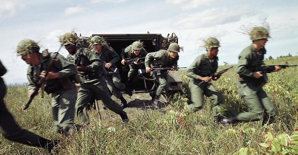 U.S. Army infantrymen unload from an M113 armored personnel carrier during a training exercise in 1985