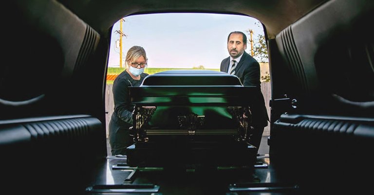 funeral loading a casket into a hearse civil war funeral industry