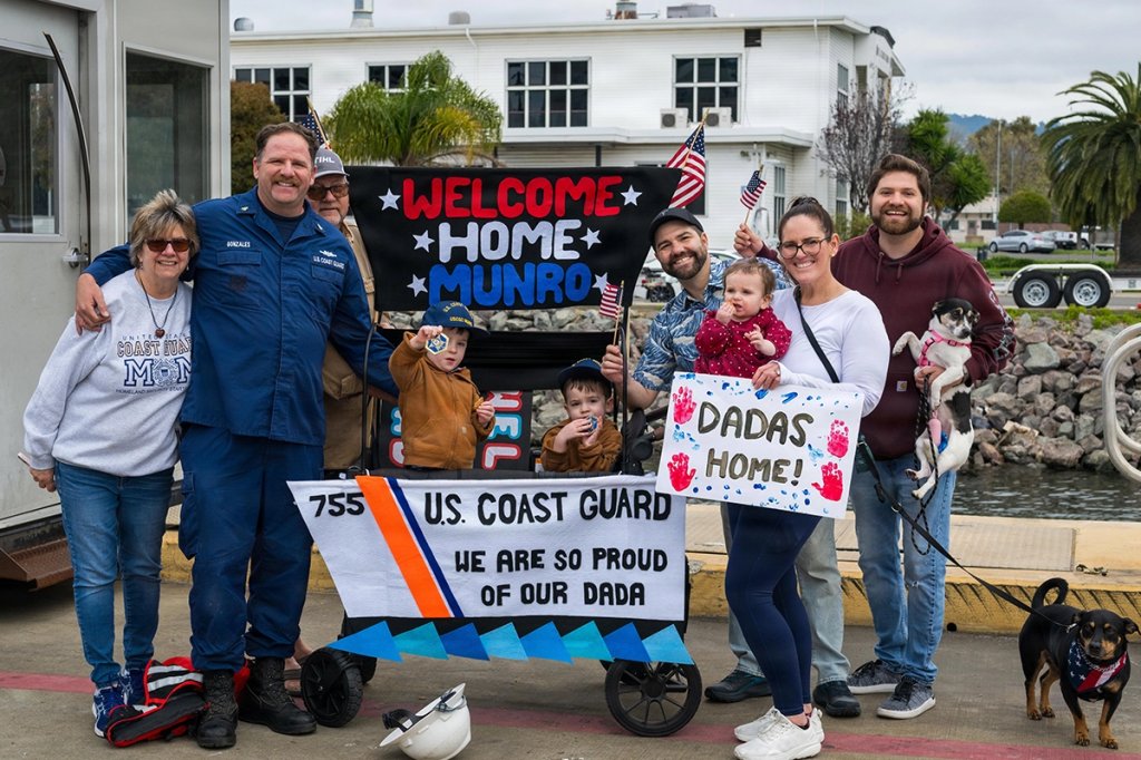 Chief Petty Officer Joseph Gonzalez of the USCGC Munro is greeted by his family during the cutter’s return to its home port after a historic 119-day multi-mission deployment spanning more than 26,000 miles from the Eastern Pacific Ocean to the Northern Atlantic