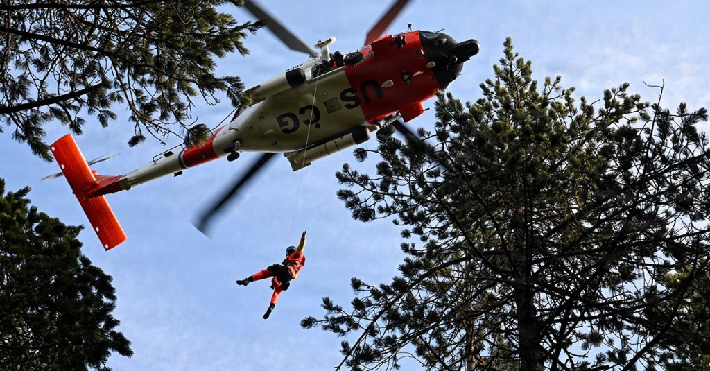 U.S. Coast Guard MH-60 Jayhawk helicopter aircrew train as part of the Advanced Helicopter Rescue School (AHRS)