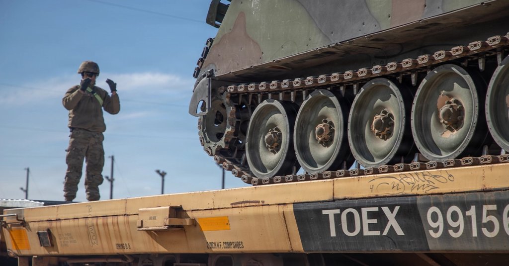 U.S. Army Sgt. Christopher Combs, assigned to 3rd Field Artillery Regiment, 1st Armored Brigade Combat Team, 1st Armored Division, guides a M113 armored personnel carrier at Fort Bliss, Texas, Jan. 12, 2026. U.S. Soldiers load different U.S. Army vehicles onto railroads to be transported to Europe for an upcoming deployment. (U.S. Army photo by Pfc. Sean Hoch)