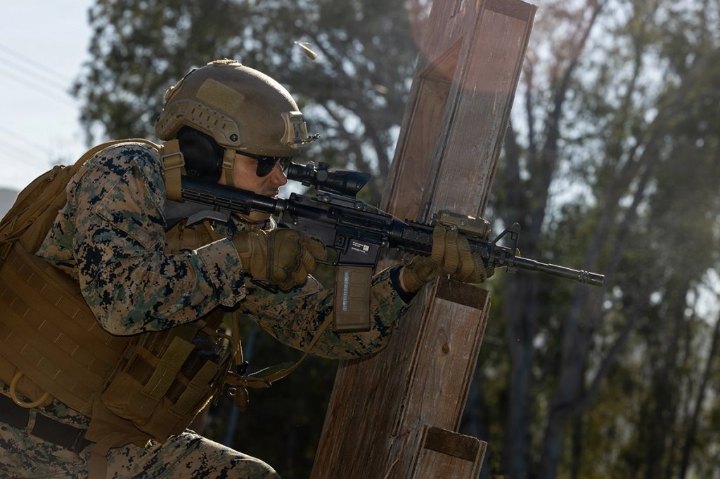 U.S. Marine Corps Master Sgt. Steven Baez, a communications chief with Combat Logistics Regiment 17, 1st Marine Logistics Group, fires an M4 carbine near perfect service rifle during Annual Rifle Qualification Tables 3-6 range at Marine Corps Base Camp Pendleton, California, March 11, 2026. The range reinforces fundamental marksmanship skills and ensures Marines maintain the accuracy, confidence, and combat readiness required to effectively engage targets in operational environments. (U.S. Marine Corps photo by Lance Cpl. Mhecaela Watts)