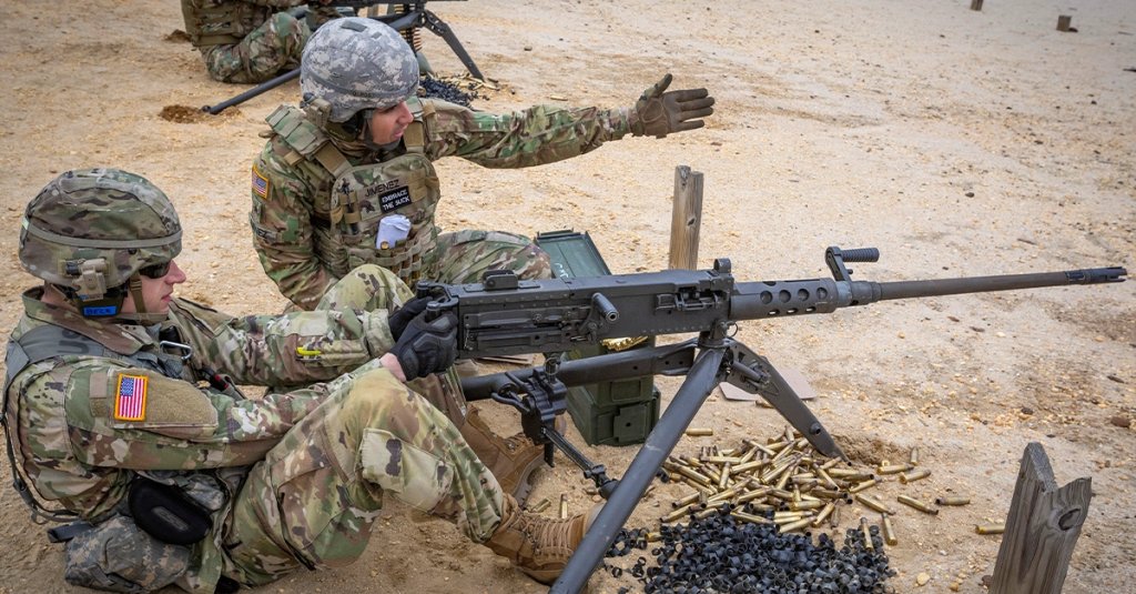 U.S. Army 1st Lt. Robert J. Beck, left, prepares to fire a M2 .50 caliber machine gun while Sgt. Jose M. Jimenez-Baez, both with the 50th Chemical Company, New Jersey Army National Guard, indicates which targets to fire at during the unit’s annual training at Joint Base McGuire-Dix-Lakehurst, N.J., May 1, 2019. (New Jersey National Guard photo by Mark C. Olsen)
