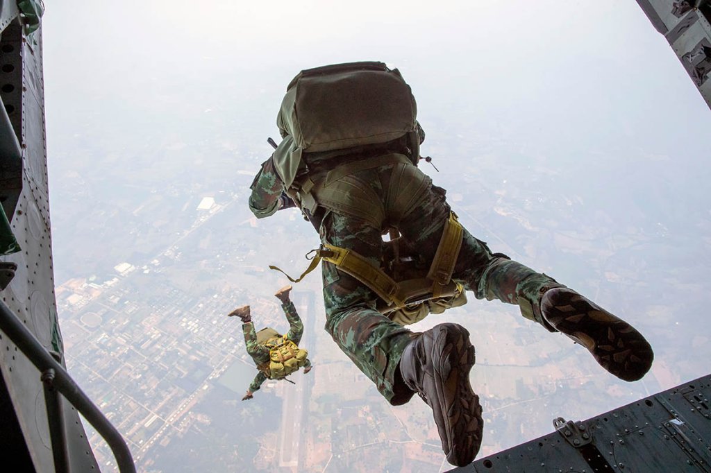 Army Rangers jump out of airplane.